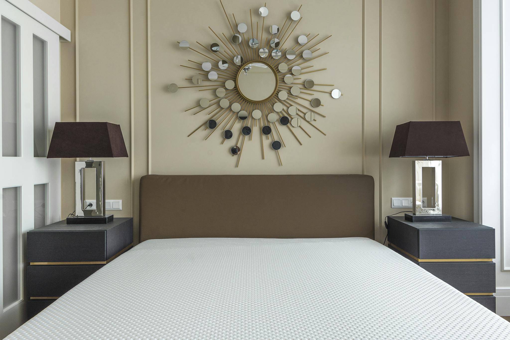 Modern bedroom featuring a minimalist design with stylish decor and furniture.